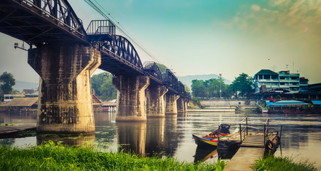 The bridge on the river Kwai at sunrise. Railway in Kanchanaburi, Thailand. Panorama