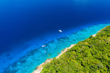 Aerial drone view of diving and snorkel boats around the beautiful tropical Similan Islands in Thailand