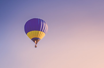 Colorful hot air balloon flying in the blue sky