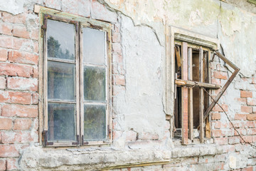 Fototapeta na wymiar The windows of abandoned dilapidated house