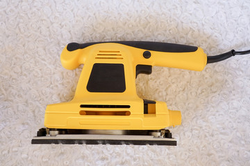 Fototapeta premium Electrical sanding machine or sander. woodworking tools for industry and production.