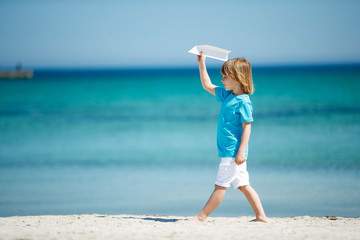 The child launches the plane