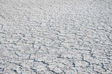 Salt mine in Milos island in Greece. It is one of the oldest salt pits in Greece. Dried crystallized sea salt in the ground