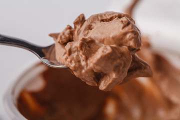 scooping chocolate ice cream close up shot, shallow focus