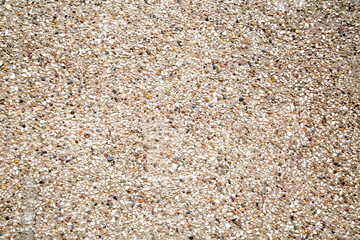 Background of concrete wall made of white gravel and colored pebbles. Backgrounds graphic design  textures.