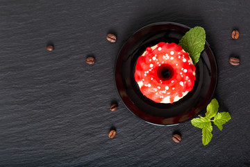 Food bakery concept homemade summer red berry sponge cake on black slate stone plate