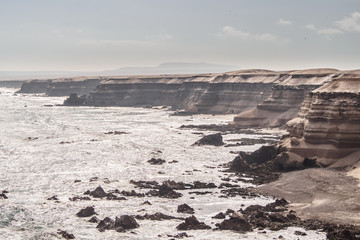 Cliffs on the north coast of Chile next to the city of Antofagasta next to the stone arch of La Portada