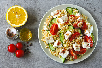 Healthy salad with bulgur, vegetables and feta. Middle Eastern style.