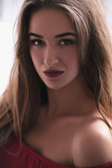 Fototapeta premium Close up portrait of beautiful young woman's face