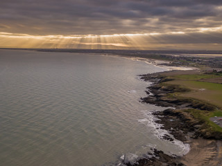 Aerial view of the sun shining on Dublin City from Donabate Beach.