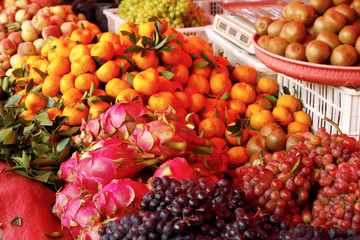 Naklejka na ściany i meble Colorful fruit at the village market of Shaxi, Yunnan, China
