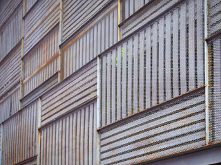 Full Frame Patterned Wooden Planks and Rusty Metal Frame Facade with Selective Focus