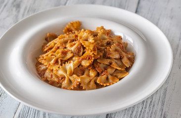 Portion of farfalle with sun-dried tomato pesto