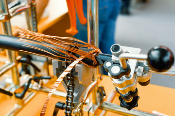 Stripping electrical cable from insulation.