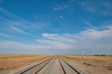 Railroad, railway tracks railings going to the horizon