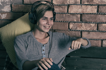 Young attractive guy listening to music.