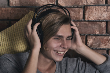 Young attractive guy listening to music.