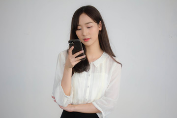 Fototapeta na wymiar portrait of thai china adult office girl white shirt using her smart phone