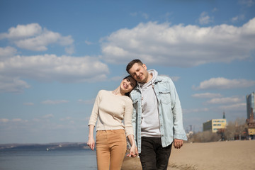 stylish young couple spends time together on the beach. 
