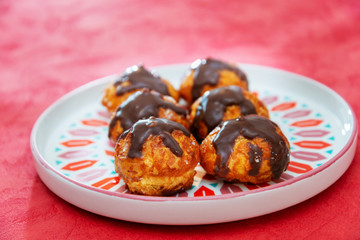 Profiterole with vanilla and chocolate sauce