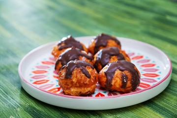 Profiterole with vanilla and chocolate sauce