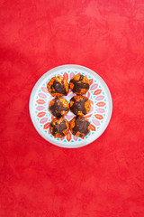 Profiterole with vanilla and chocolate sauce