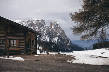 Wooden House in Alpine Mountain Landscape