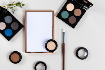 Eye shadow with brush and empty frame on grey background. Professional Make up and Beauty. Beautiful Make-up concept. Top view , copy space, mock up