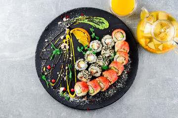 asian sushi set on wide plate, ready meal to eat, seafood