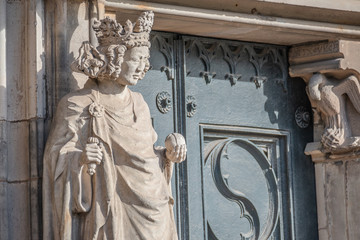 Wall figure of queen at main facade of cathedral in Magdeburg, Germany