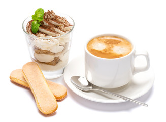 Classic tiramisu dessert in a glass and cup of coffee isolated on a white background with clipping path