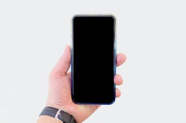 Close-up view of Man hand holding the black screen smartphone