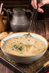 Stewed chicken porridge in a ceramic bowl
