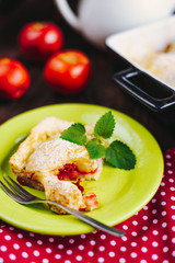 A slice of apple pie with mint