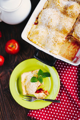 A slice of apple pie with mint