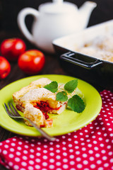 A slice of apple pie with mint