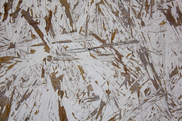 bright white fiberboard with battered paint. rough surface texture
