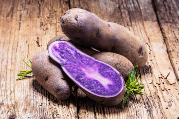 Vitolette noir or purple potato. On a white background.