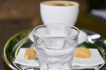 Cup of hot coffee latte on a wooden table