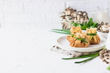Pancake bags stuffed with with fried oyster mushrooms with spinach
