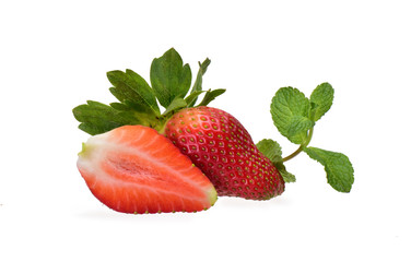 Fresh ripe strawberries - whole and cut - with a sprig of peppermint on a neutral white background