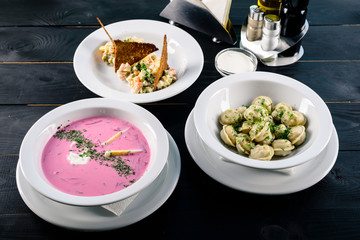 Enjoy your meal. Set of three delicious dishes served on a restaurant table