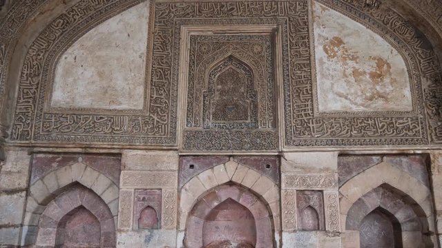 tilt up of the interior of bara gumbad at lodi gardens in delhi, india - 4K 60p