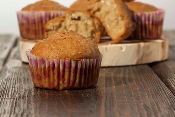 Vanilla cupcake, homemade pastry on wooden background