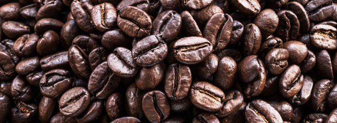 Roasted coffee beans. Food and drink background. Top view.