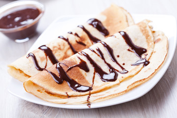 Couple Of homemade Crepes With Chocolate Sauce