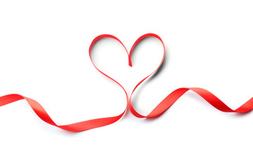 Heart made of red ribbon on white background, top view. Festive decoration