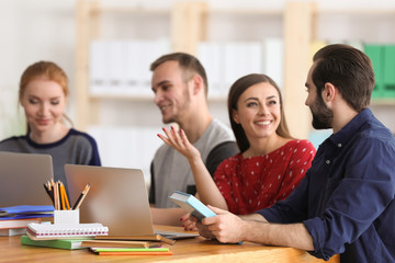 Students doing homework together in library