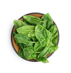 Bowl of fresh spinach leaves isolated on white, top view