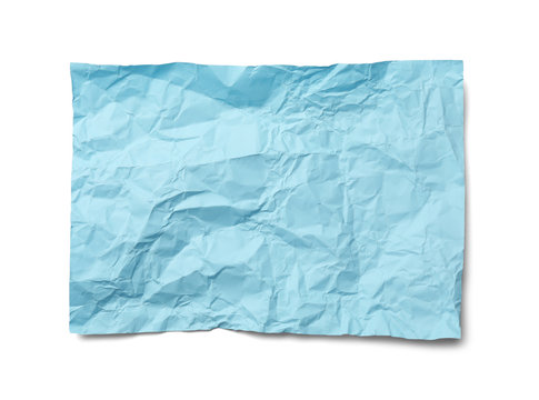 Color sheet of crumpled paper on white background, top view